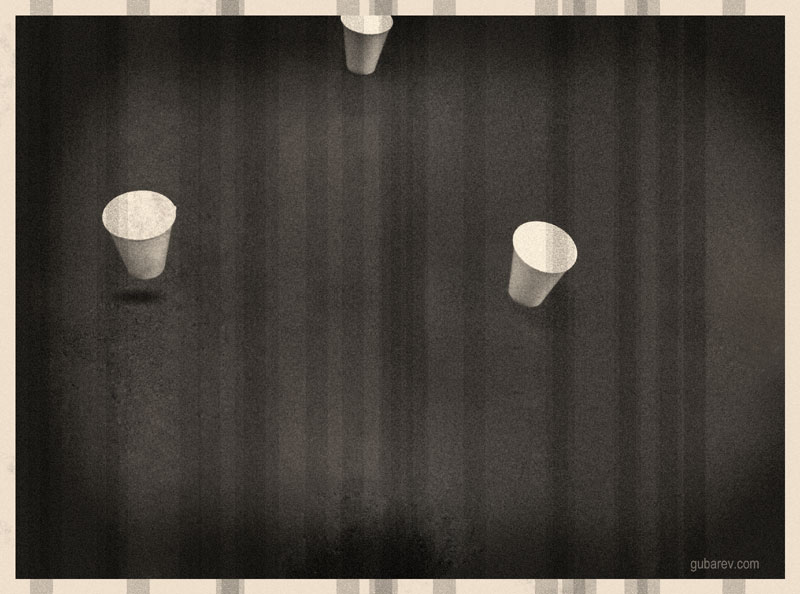 a table with flying cups